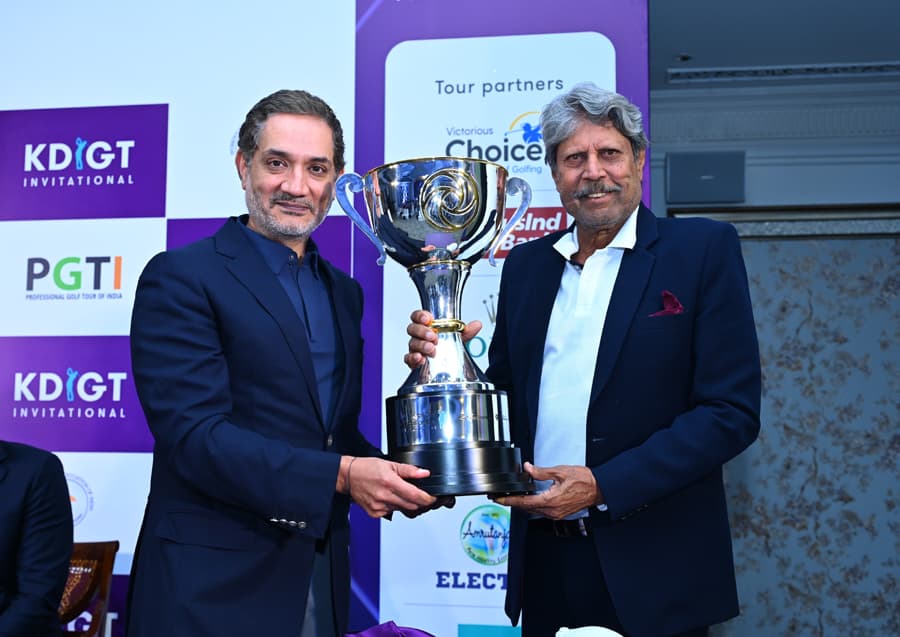 Mr. Vishesh Chandiok & Mr. Kapil Dev pose with the trophy